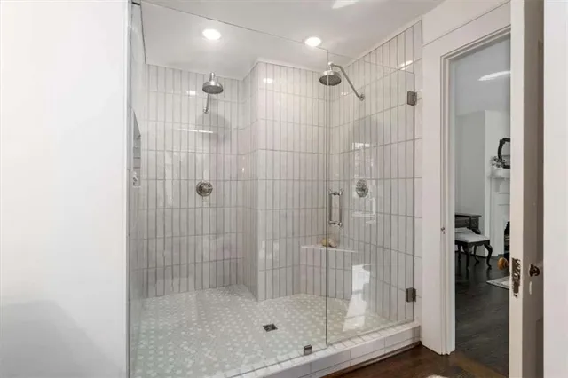 a view of empty room with wooden floor and fireplace