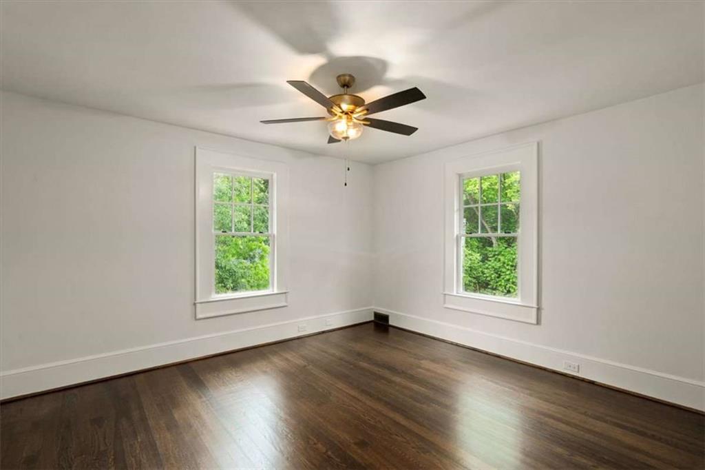 6104 Floyd Street Northeast Covington, GA 30014 - Photo 28 of 53 an empty room with wooden floor and windows