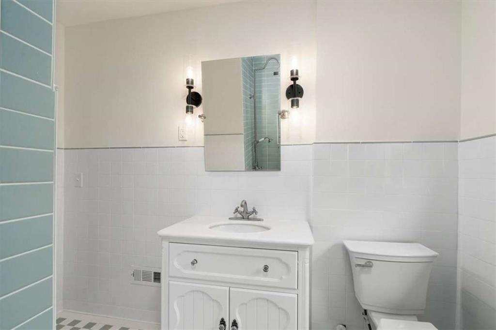 6104 Floyd Street Northeast Covington, GA 30014 - Photo 29 of 53 a bathroom with a sink toilet and shower