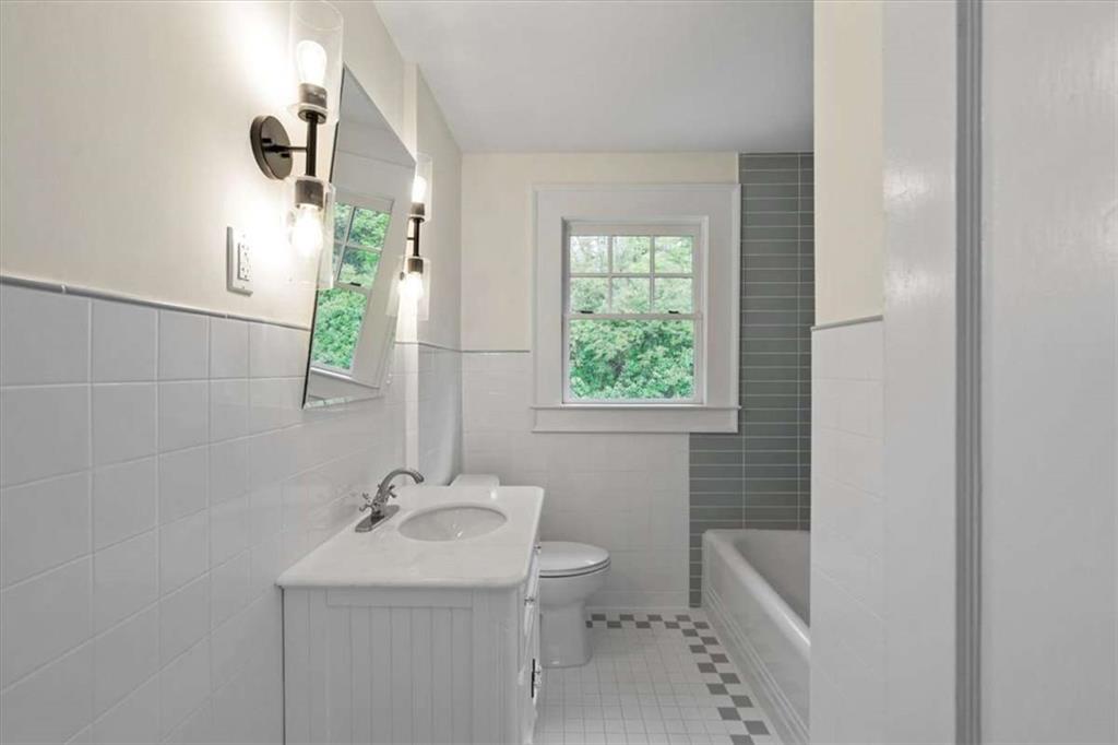 6104 Floyd Street Northeast Covington, GA 30014 - Photo 30 of 53 a bathroom with a sink toilet and shower