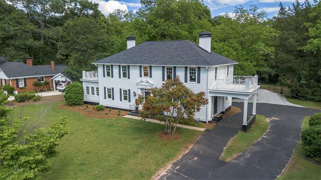 6104 Floyd Street Northeast Covington, GA 30014 - Photo 33 of 53 a front view of a house with a garden