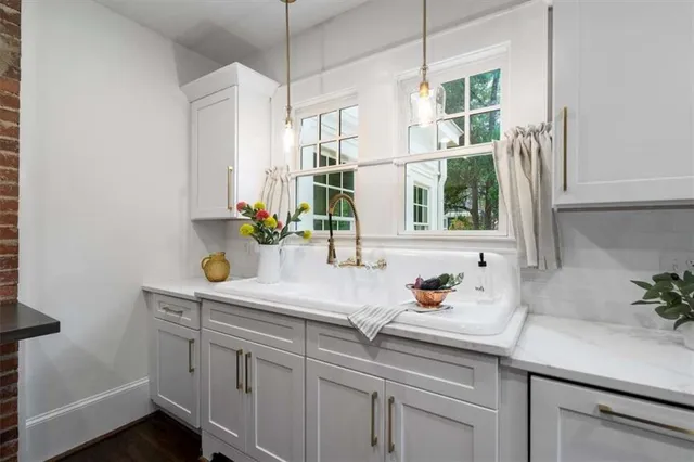 a living room with furniture and windows