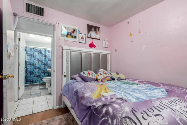 a bathroom with a sink a toilet and shower curtain