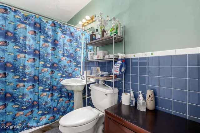 a view of a patio with a table and chairs