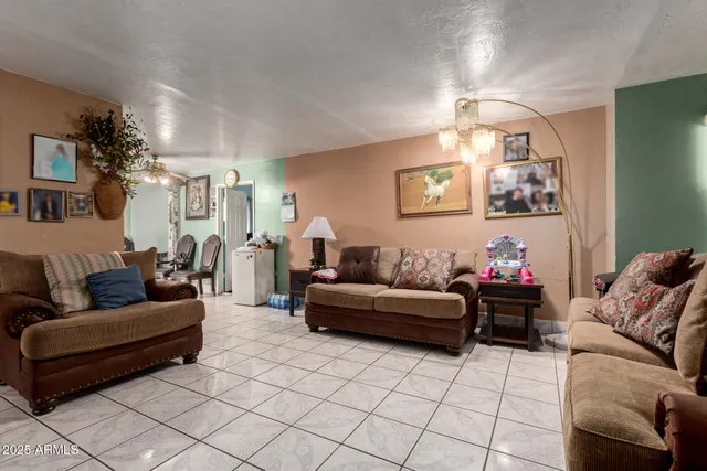 a view of a dining room with furniture and window