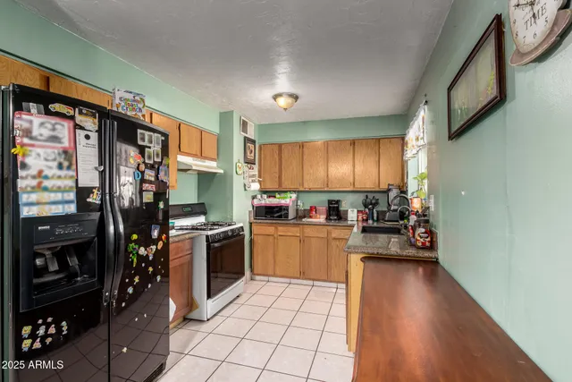 a bedroom with a bed and a television