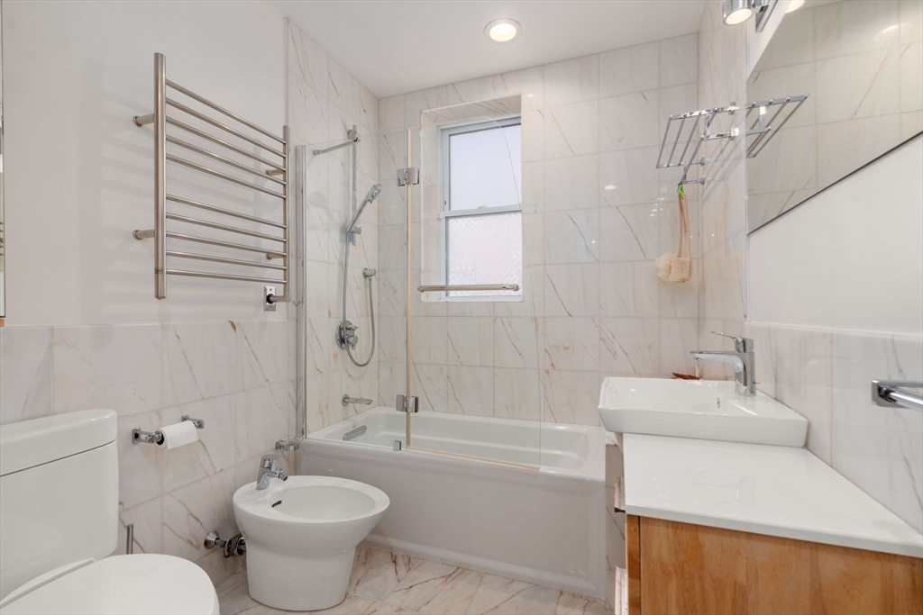 7 Parkman Street, Unit 1 Brookline, MA 02446 - Photo 21 of 27 a bathroom with a sink toilet and shower