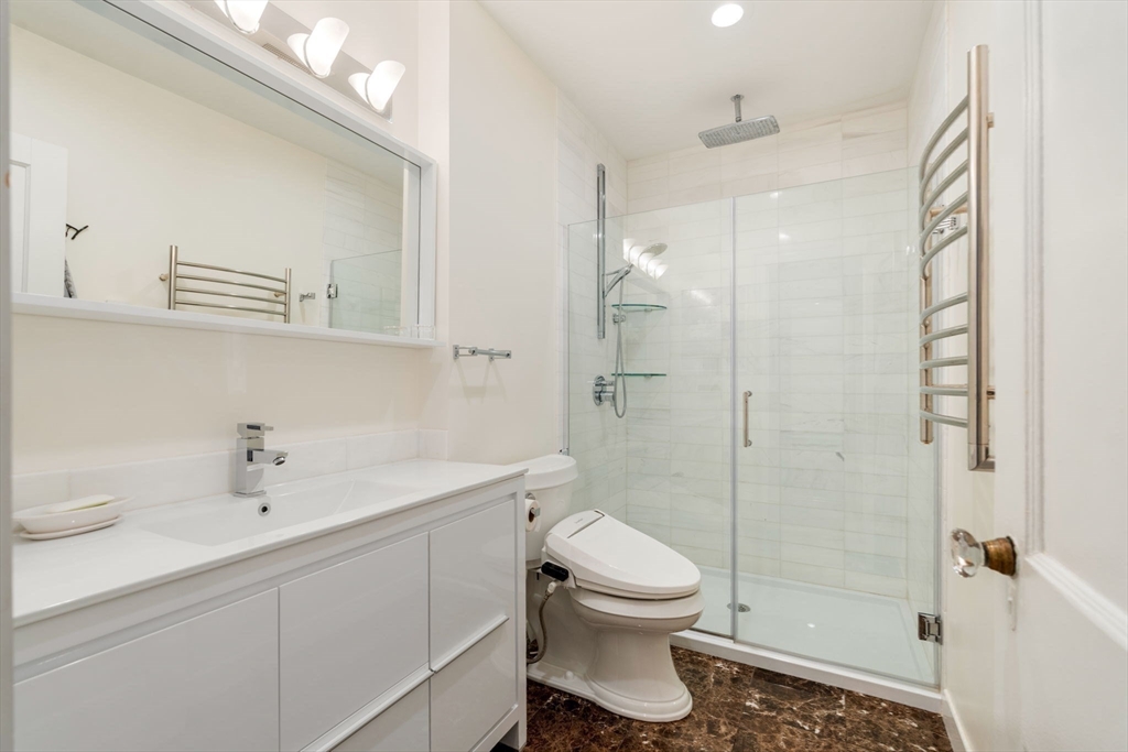 7 Parkman Street, Unit 1 Brookline, MA 02446 - Photo 23 of 27 a bathroom with a sink toilet and shower
