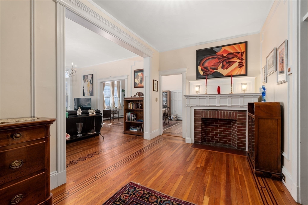 7 Parkman Street, Unit 1 Brookline, MA 02446 - Photo 3 of 27 a living room with furniture and a fireplace