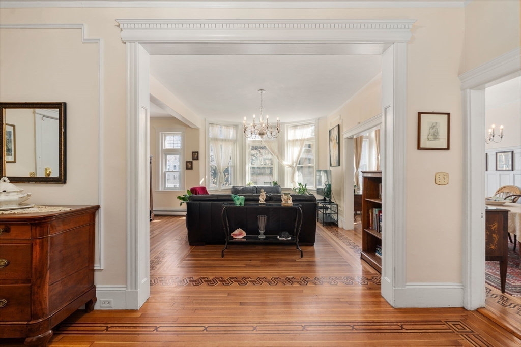 7 Parkman Street, Unit 1 Brookline, MA 02446 - Photo 4 of 27 a living room with furniture windows and a wooden floor