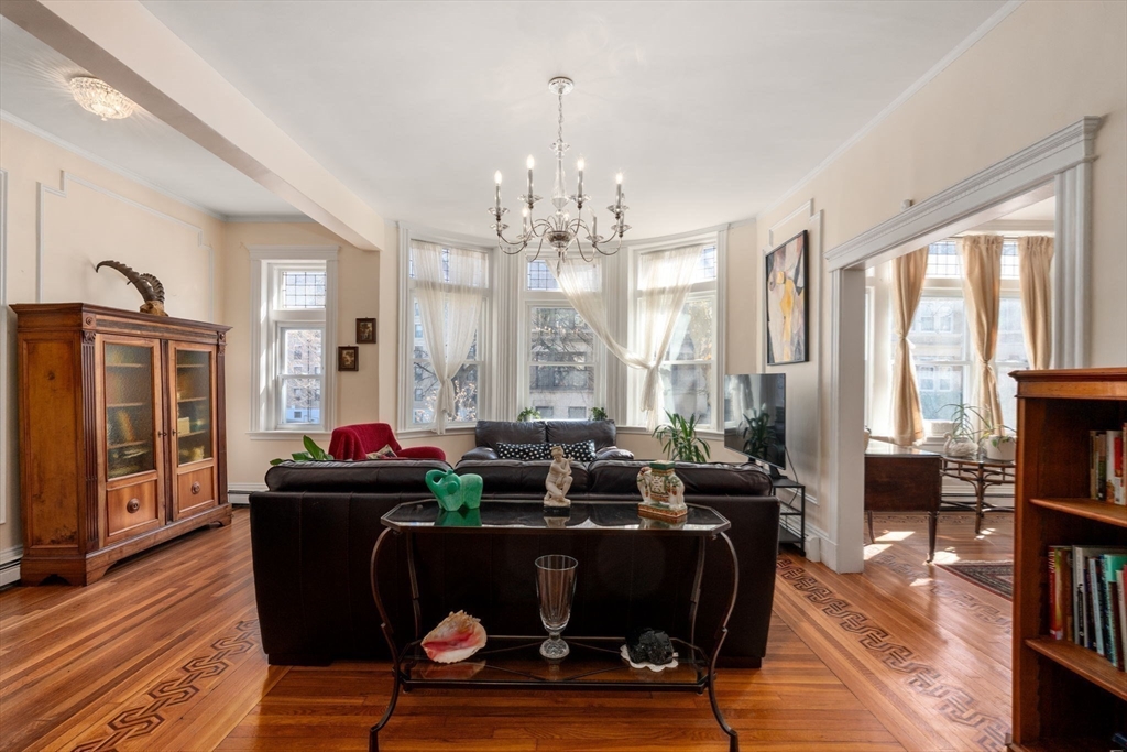 7 Parkman Street, Unit 1 Brookline, MA 02446 - Photo 5 of 27 a living room with furniture and large windows