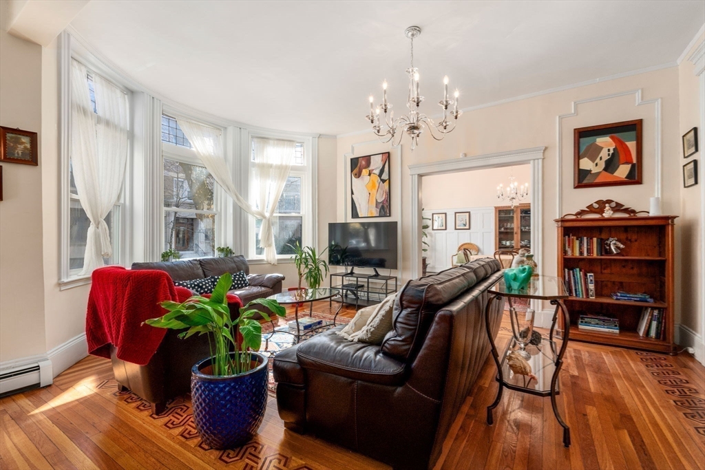 7 Parkman Street, Unit 1 Brookline, MA 02446 - Photo 6 of 27 a living room with furniture flowers and wooden floor