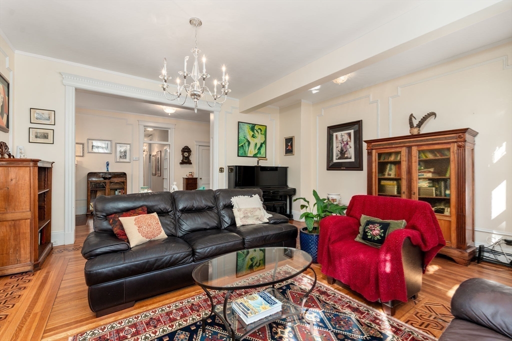 7 Parkman Street, Unit 1 Brookline, MA 02446 - Photo 8 of 27 a living room with furniture and a fireplace