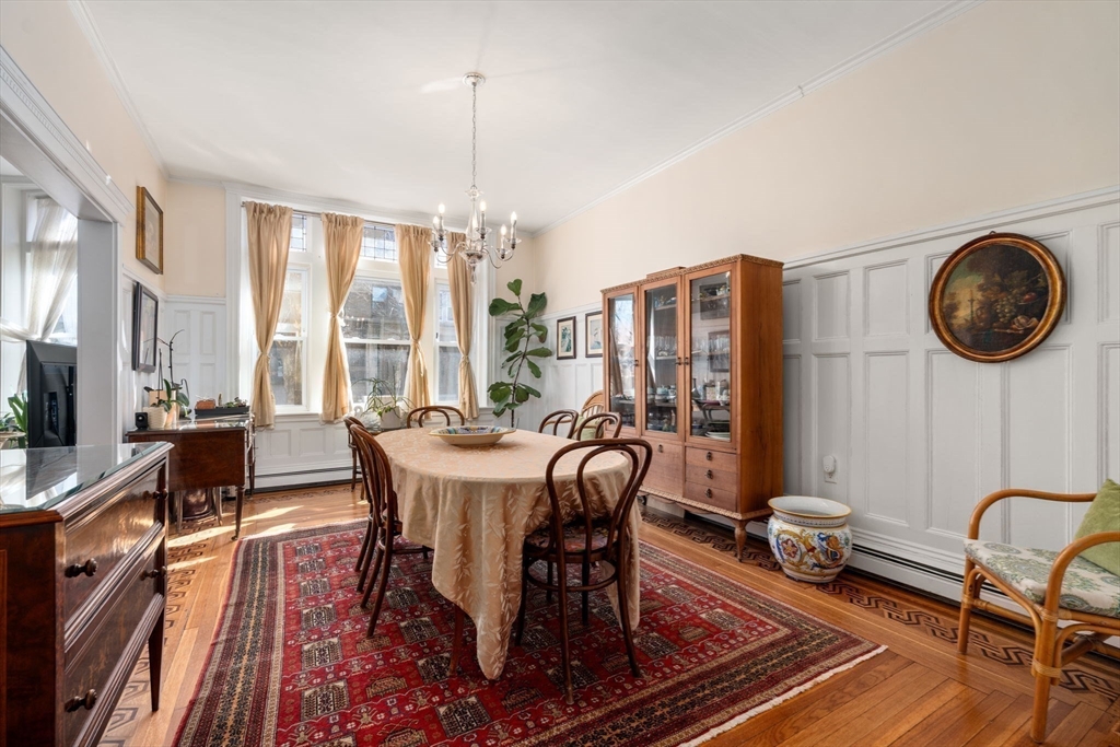 7 Parkman Street, Unit 1 Brookline, MA 02446 - Photo 9 of 27 a view of a dining room with furniture window and wooden floor