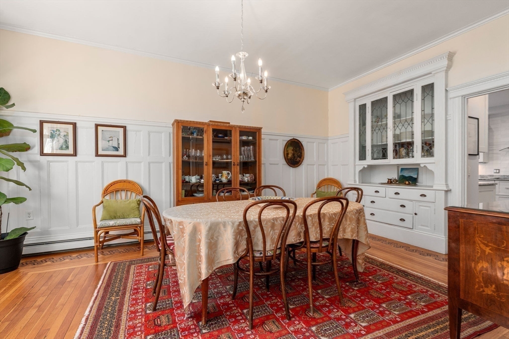7 Parkman Street, Unit 1 Brookline, MA 02446 - Photo 10 of 27 a view of a dining room with furniture and chandelier