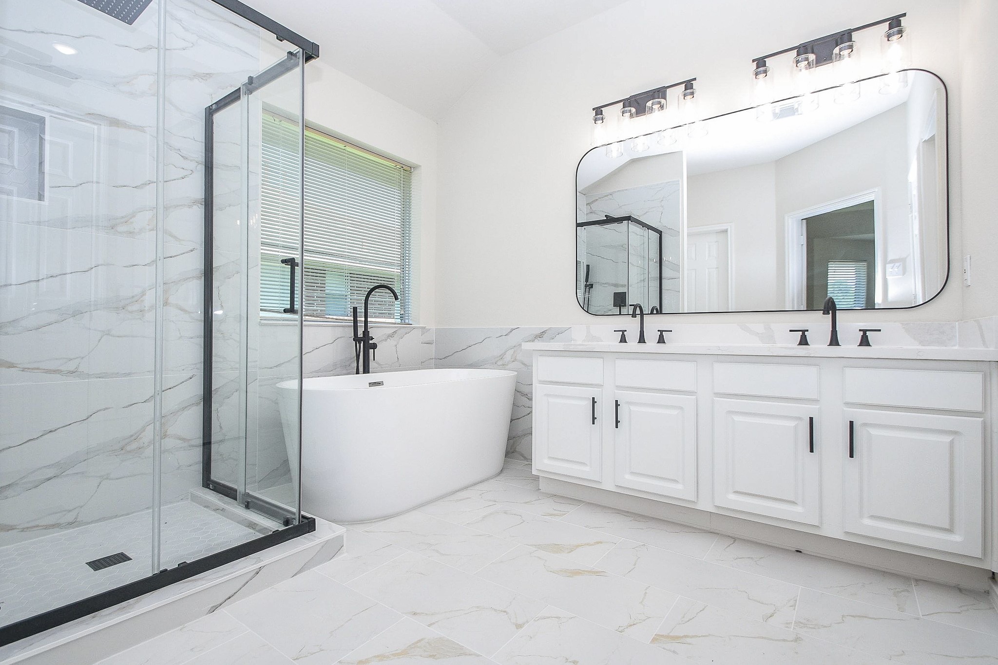 4810 Arbor Court Rosenberg, TX 77471 - Photo 14 of 20 a bathroom with a double vanity sink mirror and shower