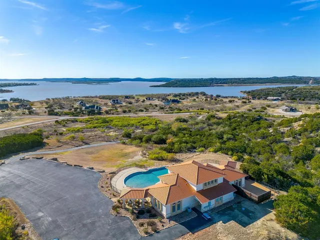 a view of a swimming pool and a yard