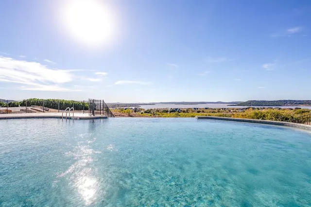 a view of a swimming pool and an outdoor seating
