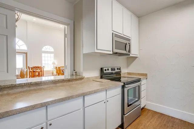 a view of a swimming pool with lounge chairs