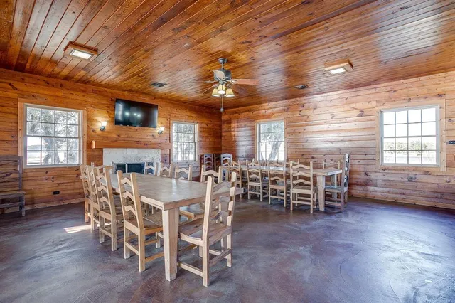 a kitchen with stainless steel appliances granite countertop a refrigerator a sink and a stove