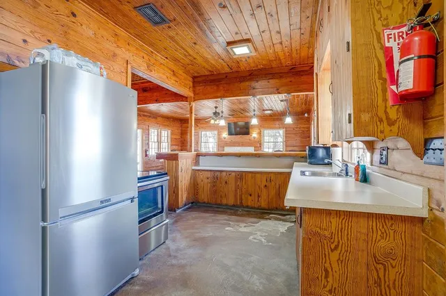 a view of a terrace with outdoor seating and lake