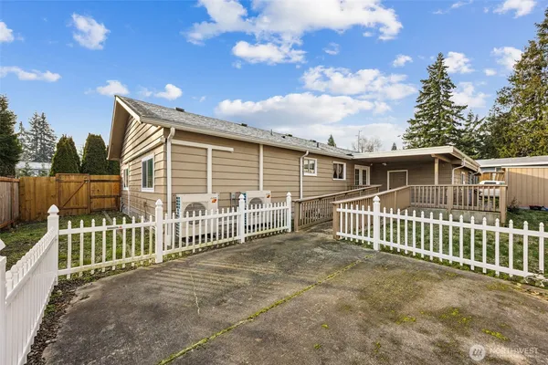 a view of a house with a fence