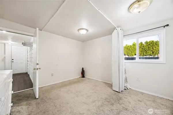 a bathroom with a sink mirror and toilet