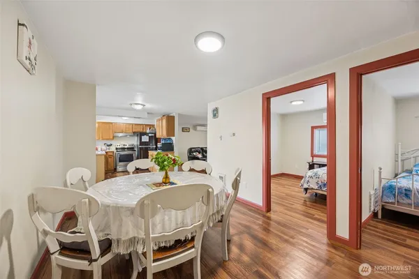 a view of a dining room with furniture and wooden floor