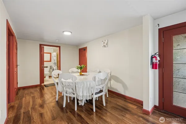 a view of a dining room with furniture window and wooden floor