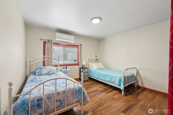 a bedroom with furniture and a window