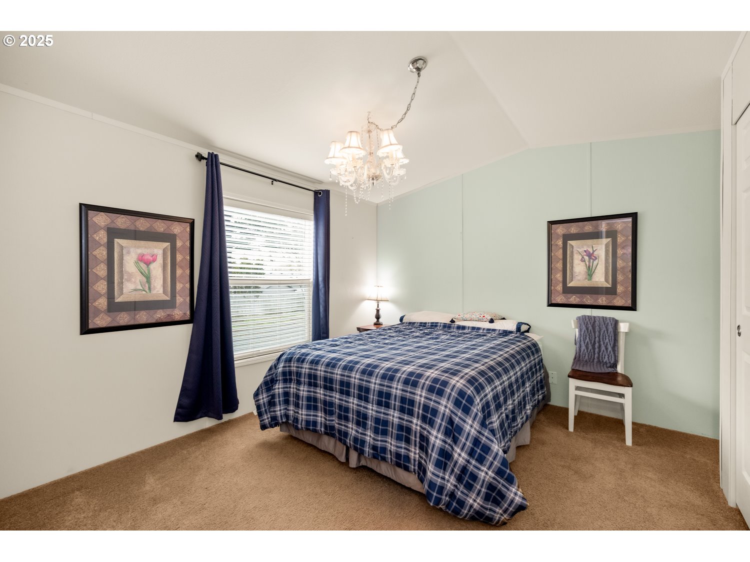 2696 Southeast Palmquist Road Gresham, OR 97080 - Photo 14 of 21 a bedroom with a bed and a window
