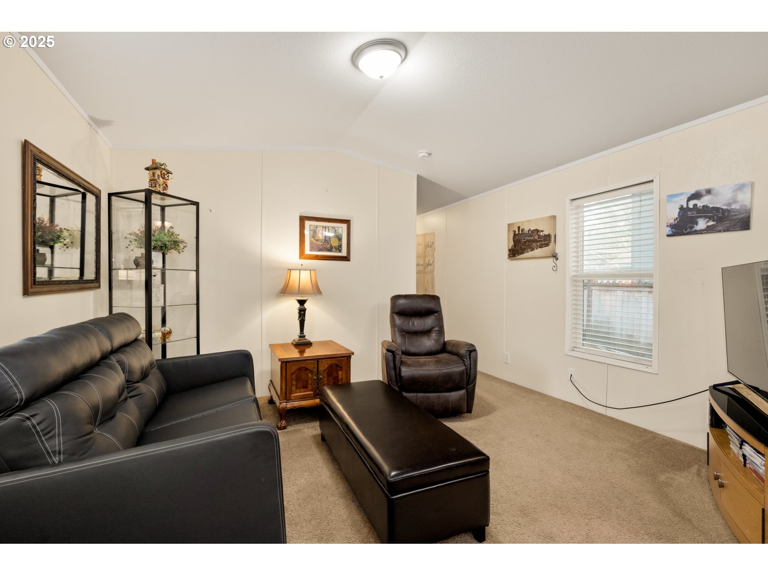 2696 Southeast Palmquist Road Gresham, OR 97080 - Photo 9 of 21 a living room with furniture and a window