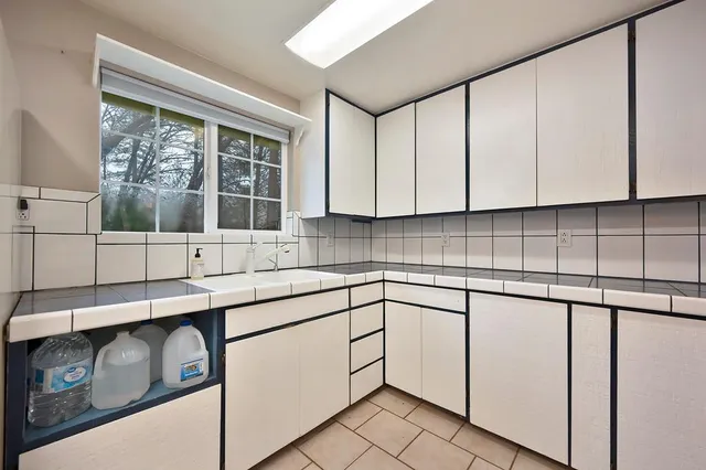 a kitchen with cabinets and appliances
