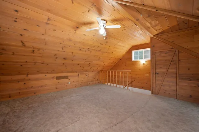 a view of a balcony with wooden floor
