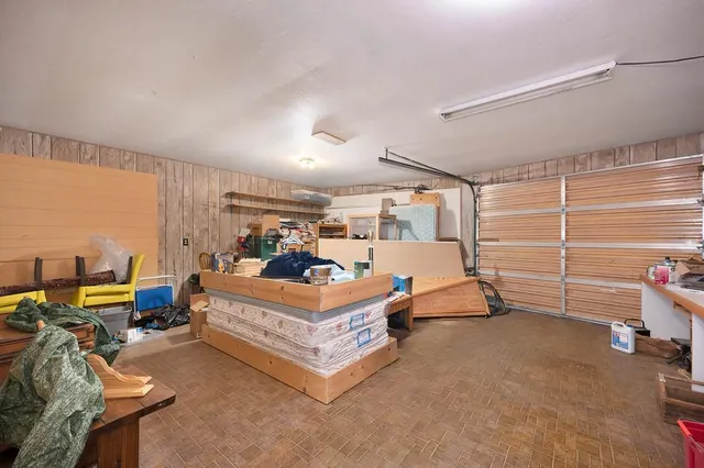 a view of a backyard with sitting area