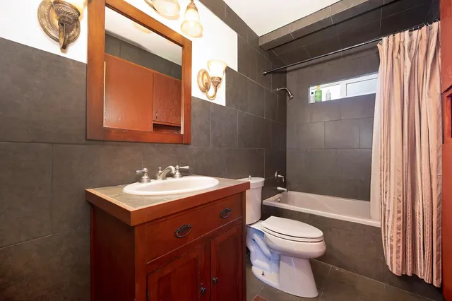 a bathroom with a toilet a sink and a bathtub