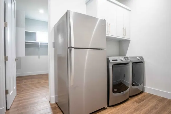 a view of a storage and utility room with washer and dryer