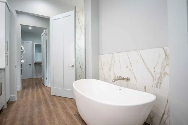 a white bath tub sitting in a bathroom