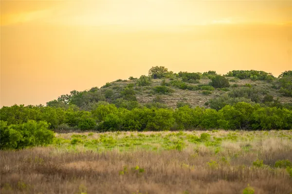 a view of mountain with green space