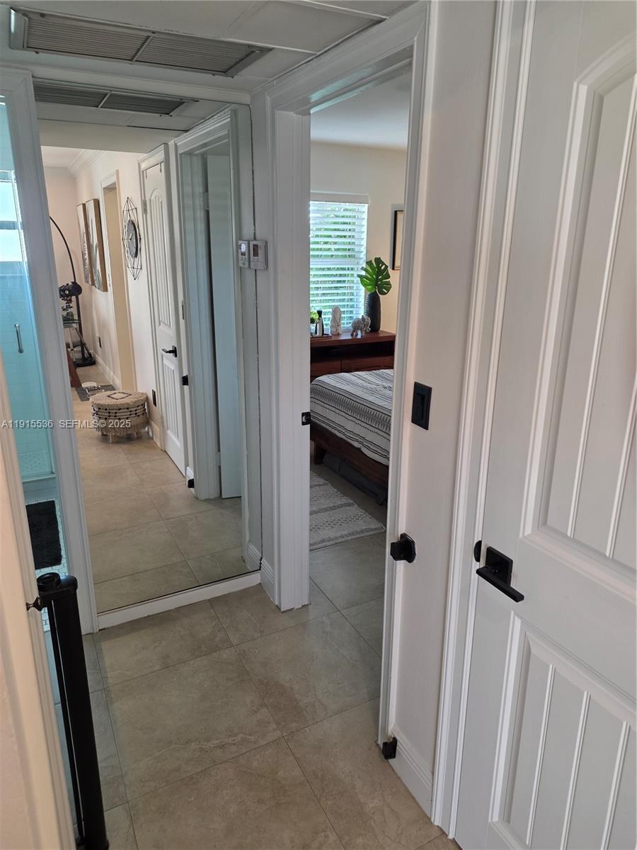 10110 Southwest 20th Street Miami, FL 33165 - Photo 11 of 20 a view of a hallway and a room