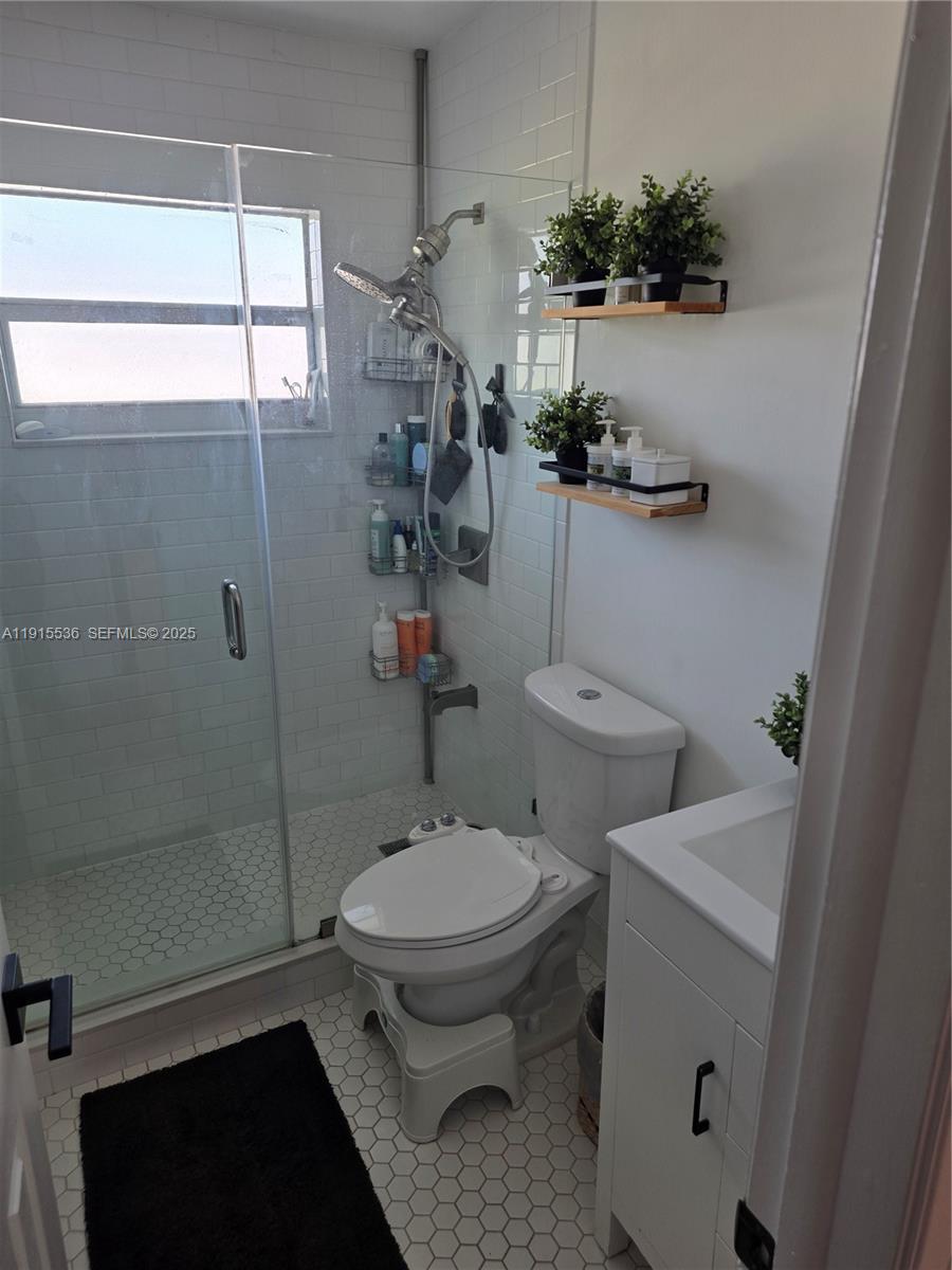 10110 Southwest 20th Street Miami, FL 33165 - Photo 15 of 20 a bathroom with a sink toilet and shower