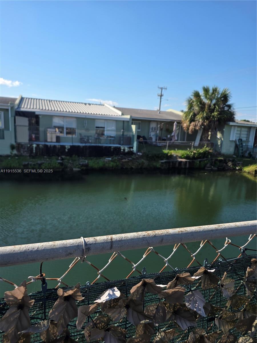 10110 Southwest 20th Street Miami, FL 33165 - Photo 18 of 20 a view of a lake with a house