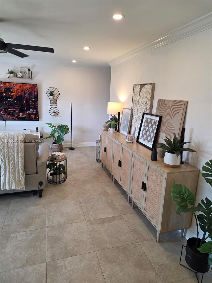 10110 Southwest 20th Street Miami, FL 33165 - Photo 4 of 20 a bed room with furniture and a potted plant