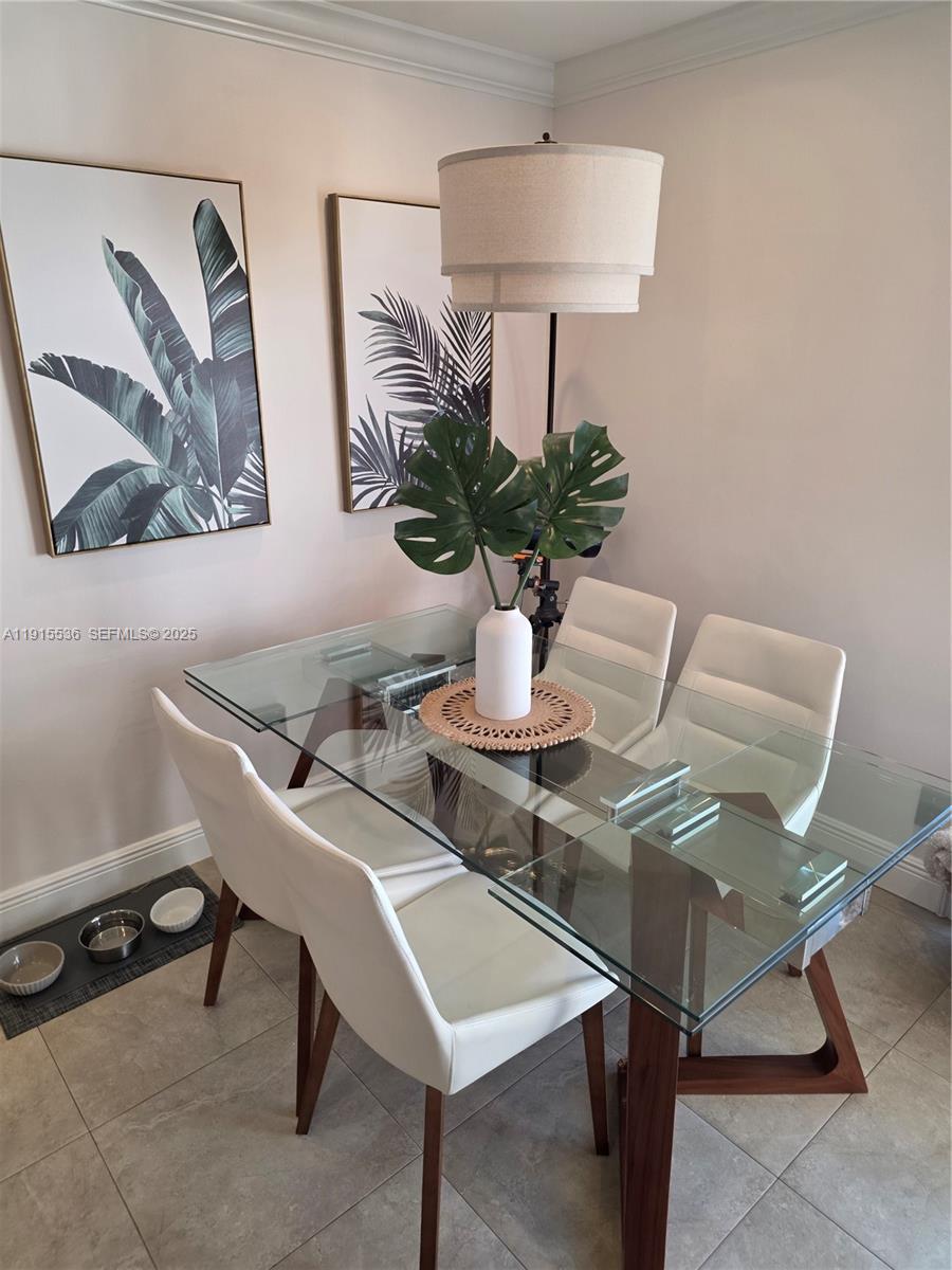 10110 Southwest 20th Street Miami, FL 33165 - Photo 6 of 20 a dining room with furniture and wooden floor