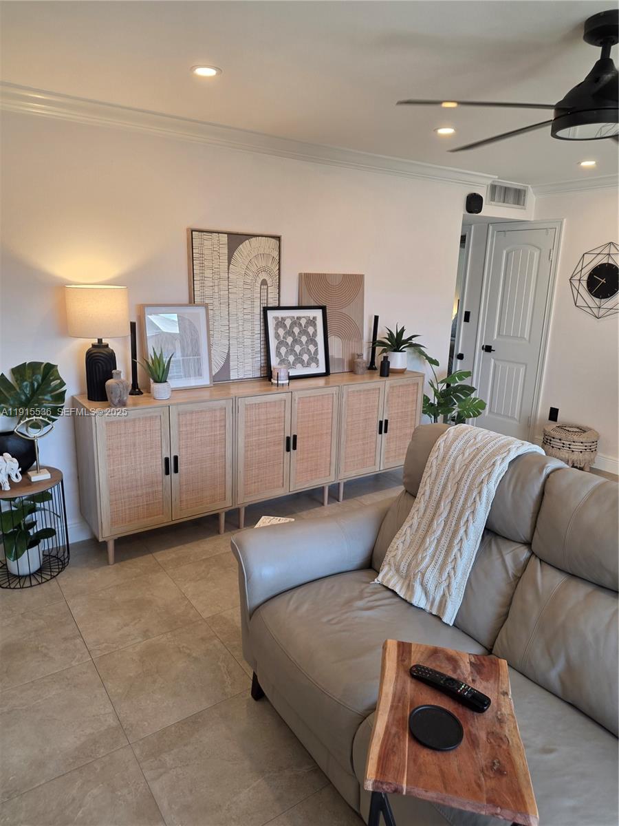 10110 Southwest 20th Street Miami, FL 33165 - Photo 8 of 20 a living room with furniture and a wooden floor