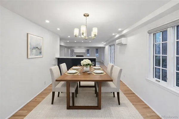 a view of a dining room with furniture and chandelier