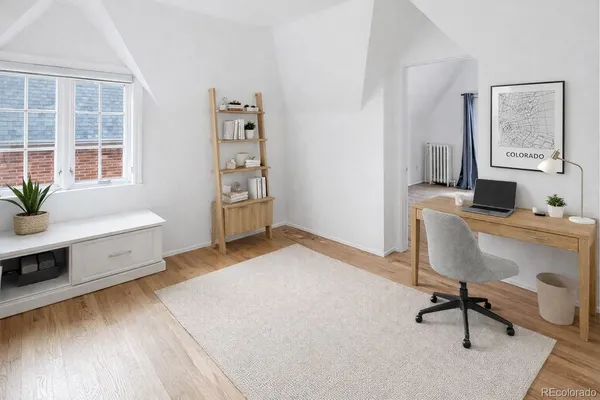 a workspace with furniture and window