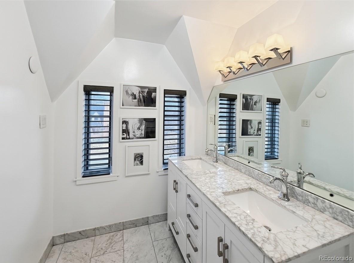 789 15th Street Boulder, CO 80302 - Photo 18 of 30 a bathroom with a granite countertop sink and a mirror