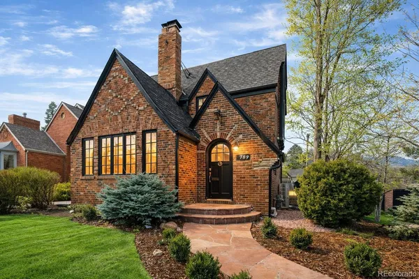 a front view of a house with garden