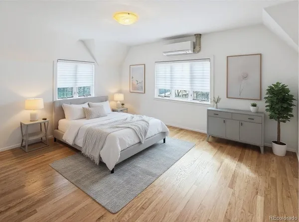 a bed room with a bed and a window